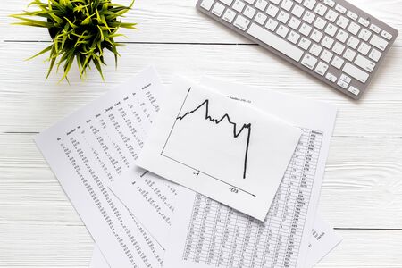 Financail crisis - business grahp, markets crash - on white wooden background top-down.の写真素材