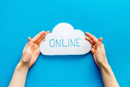 Cloud networking online internet concept. Paper bubble in hands top viewの写真素材