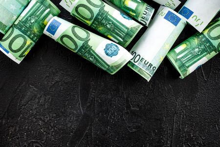 Cach euro on black background top view