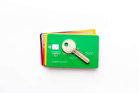 Credit card security concept with lock, wallet on black table from above