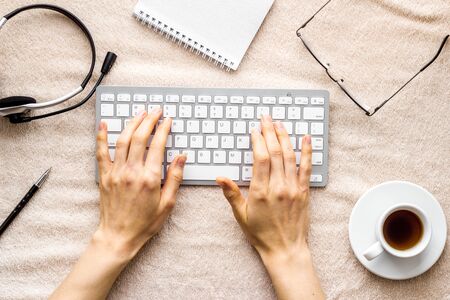Home office concept. Laptop, notebook on blanket top view.の写真素材