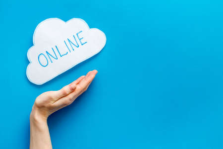 Cloud online networking concept. Paper bubble on blue workplace