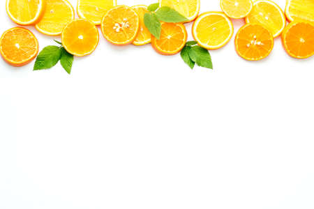 Sliced citrus on white background top view.