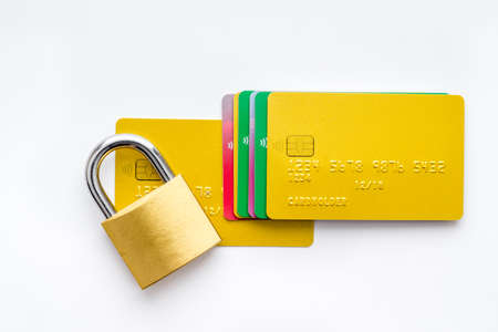 credit card with security lock on white desk top viewの写真素材