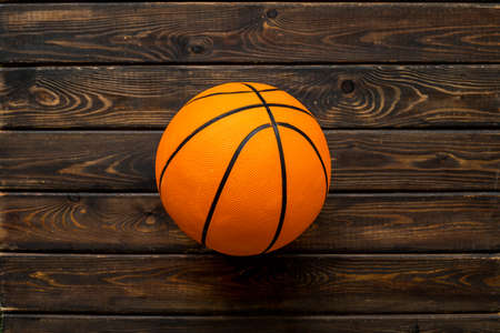 Basketball ball on wooden background top view copy spaceの写真素材