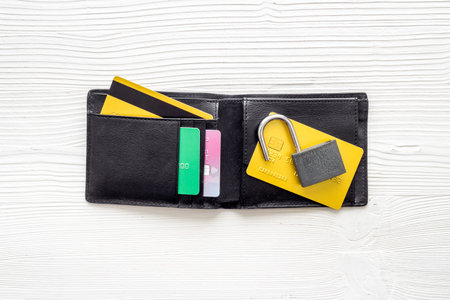 credit card hacked. open lock, wallet on white table top-downの写真素材