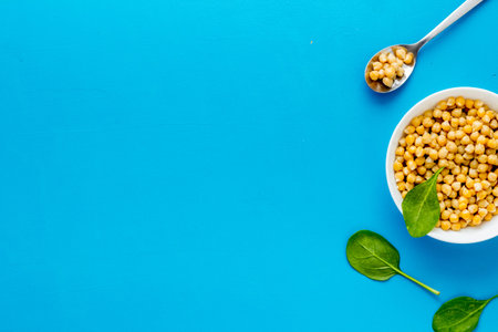 Chickpeas dishes. Vegan healthy food on blue desk top view copy space