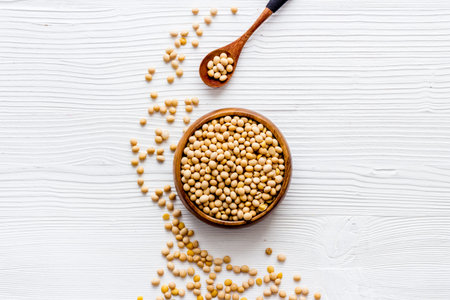 soy beans in bowl on white desk top-down