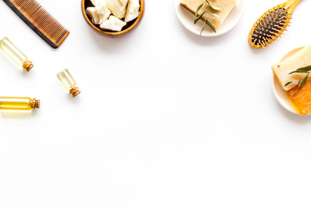 Natural hair care cosmetics - cacao butter and herbal oil, top view