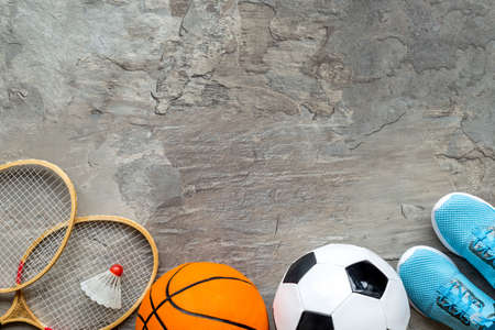 Sport games background - basketball, soccer ball, rockets, sneakers - copy spaceの写真素材