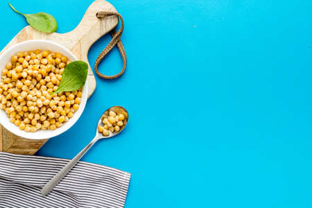 Chickpeas dishes. Vegan healthy food on blue desk top view copy spaceの写真素材