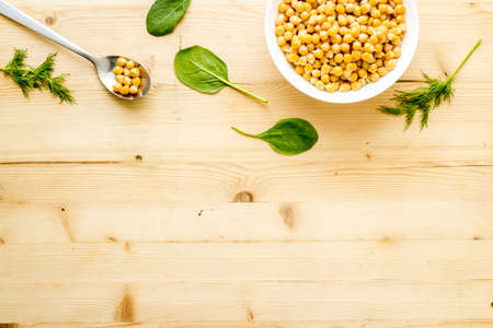 Chickpeas dishes. Vegan healthy food on wooden desk top view copy spaceの写真素材