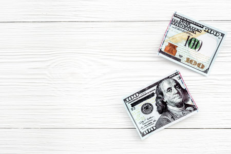 Cutting of US dollar banknote. Economic crisis concept