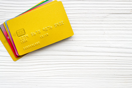 security concept. stack of credit card on white desk top-down copy spaceの写真素材