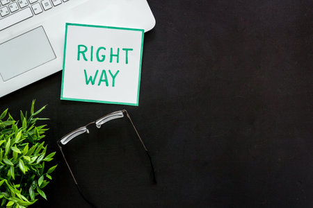 Right way icon on black office desk top view copy space