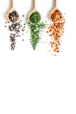 Asian and Indian spices and herbs in wooden spoons for cooking