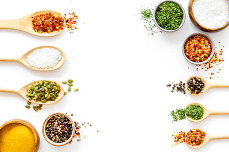 Asian and Indian spices and herbs in wooden spoons for cookingの写真素材