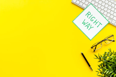 Right way icon on yellow office desk top view copy space