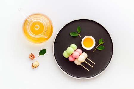 Asian dessert Dango rice dumplings and japanese teaの写真素材