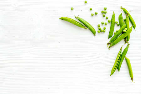 Sweet green peas on kitchen table deskの写真素材