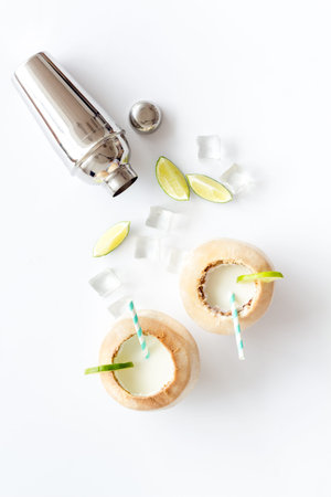 Tropical drink - coconut cocktail Margaritas or Pinacolada with ice and shaker