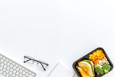 Food delivery to office. Business lunch in take away box, top viewの写真素材