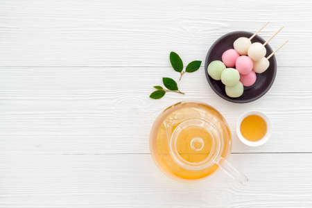 Japanese food background with sweets and tea. Three colored dumplings Dangoの写真素材