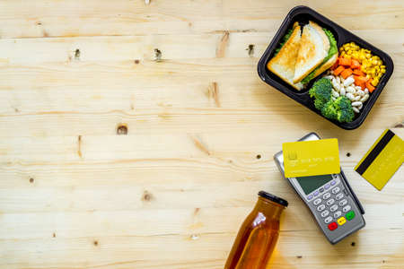 Odering food online delivery to office or home. Luch boxes on workplaceの写真素材