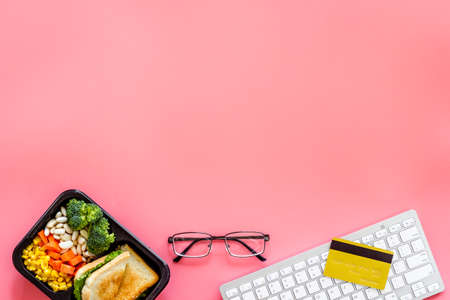 Food delivery to office. Business lunch in take away box, top view