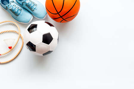 Sport games background - basketball, soccer ball, rackets, sneakers. Copy spaceの写真素材