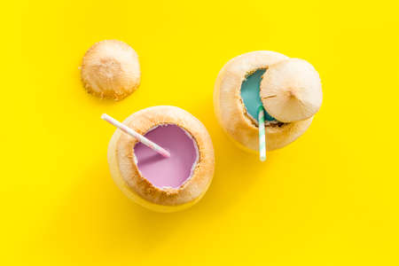 Fresh fruit drink in coconut with straw, top viewの写真素材
