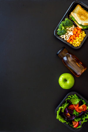 Delivery containers with takeout food on table. View from above