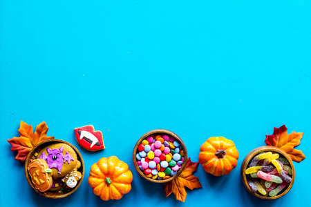 Halloween holiday banner design - pumpkins, cookies and autumn leaves, top viewの写真素材