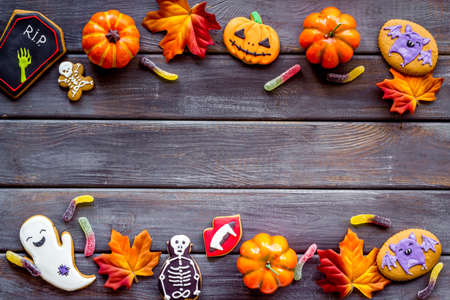 Frame of Halloween decorations with cookies and candies, top viewの写真素材