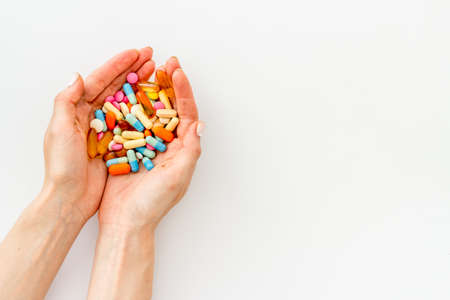 Heap of pills in hands from aboveの写真素材