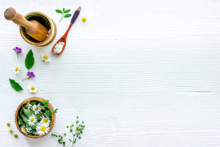Top view of herbal tea in cup with herbs in bowls, top viewの写真素材