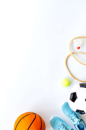 Sport games equipment - balls, sneakers, rackets - on white top view copy spaceの写真素材