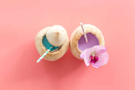 Drink in raw coconut with straw, top viewの写真素材