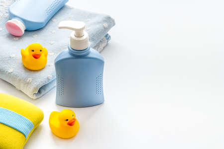 Baby accessories for bath with care products and rubber duckの写真素材