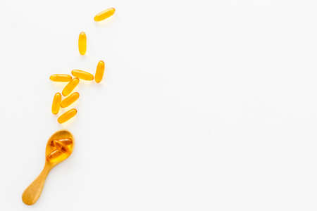 Fish oil supplement capsules and omega 3, top viewの写真素材