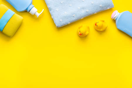 Baby cosmetic items with ducks rubber toy, from aboveの写真素材