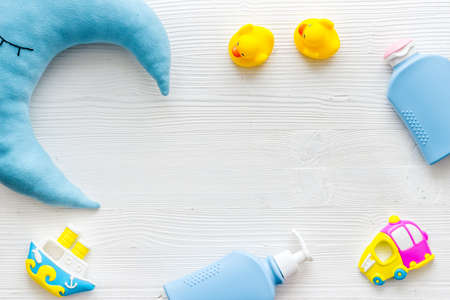 Baby cosmetic items with ducks rubber toy, from above