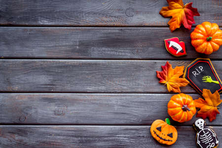 Overhead view of Halloween holiday decoration with pumpkins, cookies and candiesの写真素材