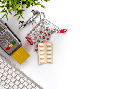 Online pharmacy shopping - payment for medicine by POS terminal with a bank cardの写真素材