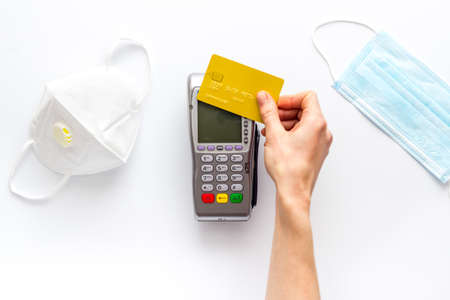 Contactless payment - terminal with medicine face masks, top viewの写真素材