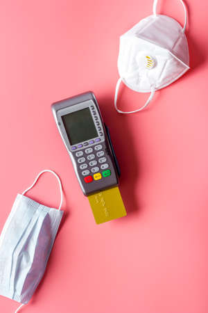 Payment terminal with face masks. Payment for hospital and medical servicesの写真素材