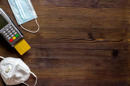 Contactless payment - terminal with medicine face masks, top viewの写真素材