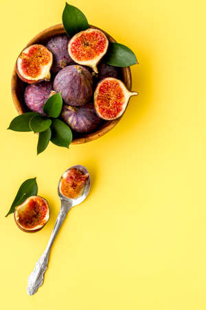 Fresh figs with green leaf, top view. Mediterranean fruit backgroundの写真素材