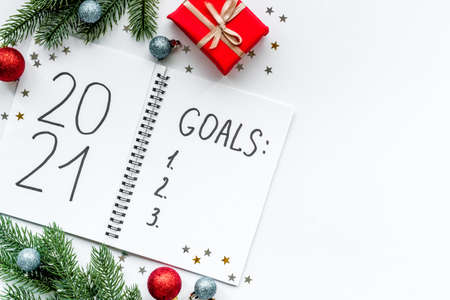 Inspiration concept - New Years goals written in notebook on a table, flat layの写真素材