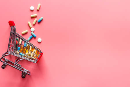 Online pharmacy shopping concept. Basket with pills and medicineの写真素材